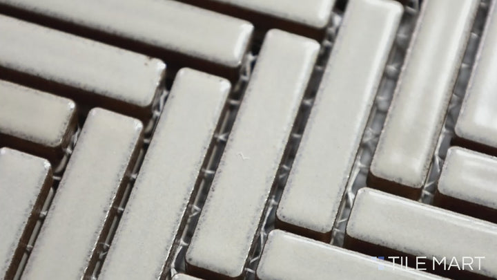 Video featuring 90° Putty Herringbone Gloss Glazed Porcelain Mosaic. A warm, neutral-toned herringbone tile that blends seamlessly with contemporary decor.