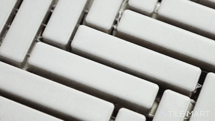 Video of 90° White Herringbone Gloss Glazed Porcelain Mosaic. A crisp white glossy herringbone pattern that enhances light reflection and modern aesthetics.