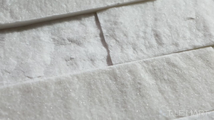 Video showcasing Rockmount Carrara 6X24 Stacked Stone Panel Splitface Marble. A stunning natural stone panel with soft white tones, perfect for accent walls and fireplaces.