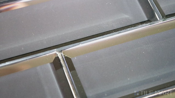 Video featuring Modern Glass Dark Grey Brick Glossy Mosaic. A deep dark grey glass tile with a glossy sheen, offering a sophisticated brick-style layout with a sleek, modern touch.