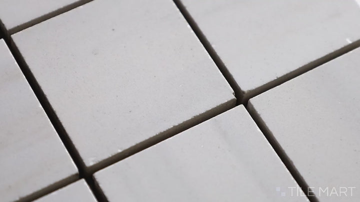 Video highlighting Exotic Stone Da Vinci White 2-inch Square Polished Porcelain Mosaic. Showcasing a crisp white tone with soft veining, this polished porcelain tile enhances spaces with its timeless appeal and sophisticated finish.
