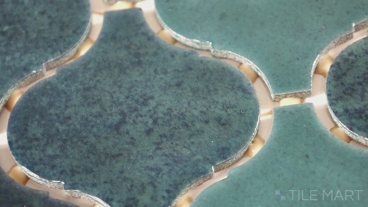 Video featuring Mesmerist Mystique Arabesque Glossy Glazed Ceramic Mosaic. A captivating arabesque mosaic with a glossy finish, ideal for creating a stunning focal point.