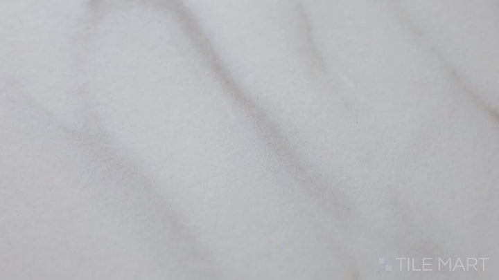 Video featuring Tele Di Marmo Reloaded Calacatta 12X24 Matte Porcelain. A luxurious white marble-look tile with subtle veining and a matte finish for timeless elegance.
