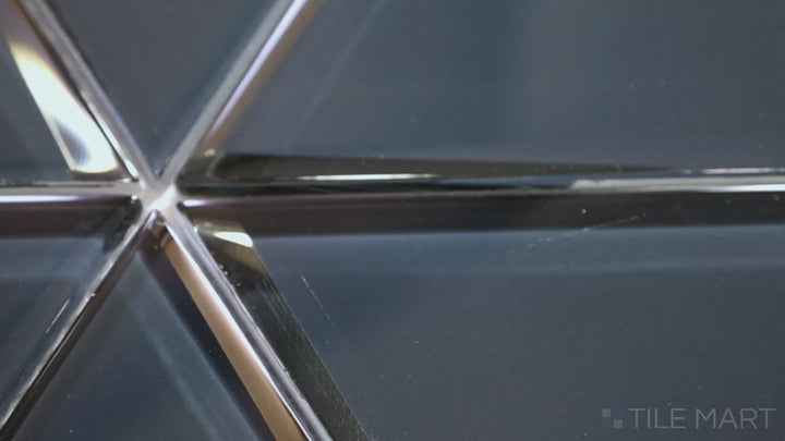 Video featuring Modern Glass Blue 6-inch Triangle Glossy Mosaic. A vibrant blue glass tile with a polished glossy surface, designed in a striking triangular pattern for a contemporary and artistic look.