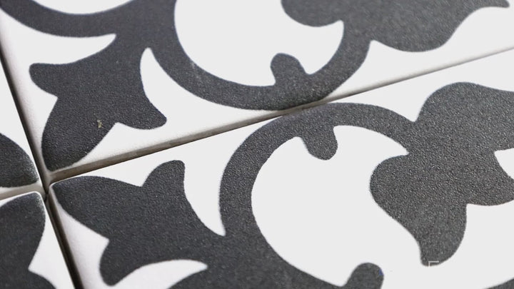 Video featuring Frame 15 Clover B&W 6x6 Matte Porcelain. A bold black-and-white pattern with a smooth matte finish, this porcelain tile delivers a striking visual appeal with a timeless, artistic touch.