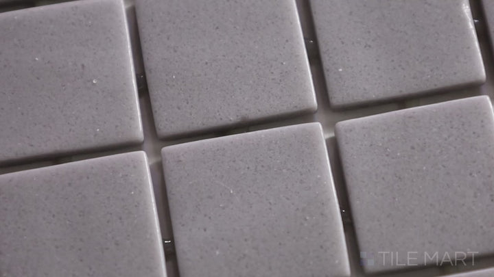 Video featuring Natureglass Malla Grey 1-inch Square Matte Glass Mosaic. A sleek grey matte glass mosaic with a structured design, perfect for a modern aesthetic.