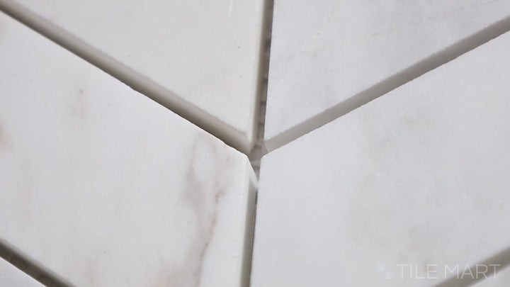 Video featuring Sto-Re Volakas Chevron Polished Marble Mosaic. A polished Volakas marble mosaic in a stylish chevron pattern for a timeless aesthetic.