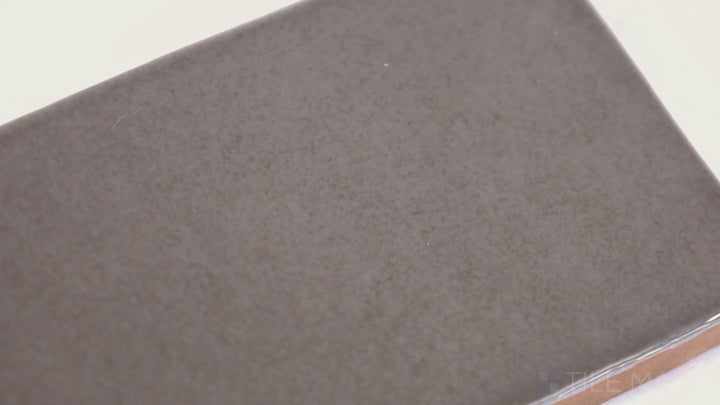 Video featuring Highland Lake Grain 3X10 Glossy Ceramic. A neutral-toned tile with a glossy sheen, adding depth and warmth to contemporary spaces.