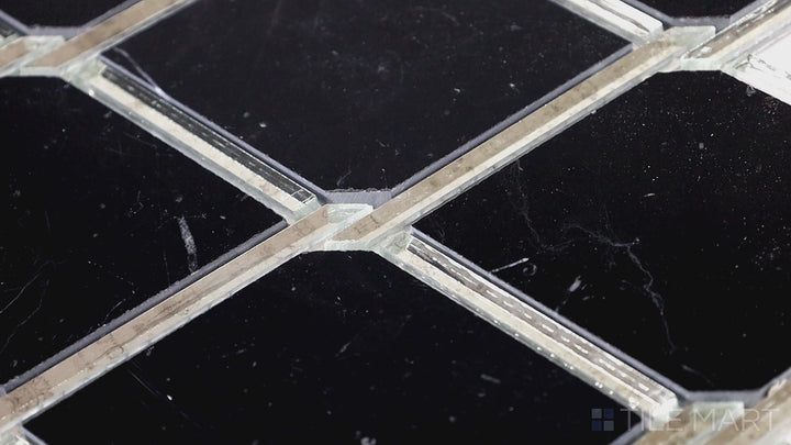 Video featuring Lavaliere Carrara White/Black Ant Mirror Chain Link Polished Carrara Mosaic. A sleek chain-link pattern with polished Carrara and black mirror, perfect for modern luxury spaces.