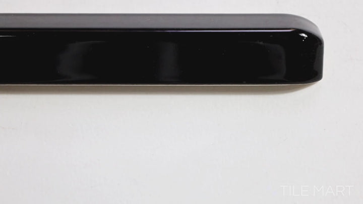 Video featuring Sanitary Cove Base Black 1x6 Glossy Ceramic Outside Corner. A sleek black glossy ceramic outside corner tile, perfect for a sharp and polished finish.
