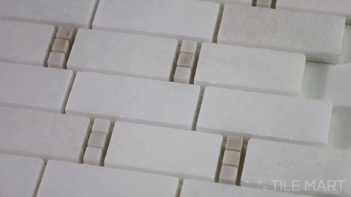 Video showcasing The Finish Line Pale Beige Subway Polished Marble Mosaic. A classic subway-style polished marble tile in a soft beige tone, ideal for elegant wall applications.