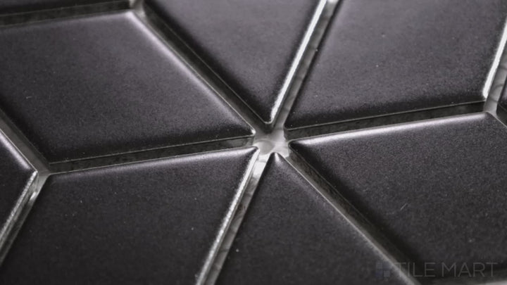 Video of Shapes Black Cube Matte Porcelain Mosaic. A matte black porcelain mosaic featuring a cube illusion, offering a structured and contemporary look.