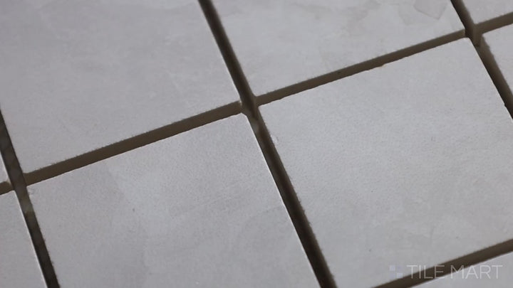 Video of Tele Di Marmo Revolution Thassos 2" Square Matte Porcelain Mosaic. A crisp, white marble-effect mosaic with a soft matte finish for a sophisticated touch.