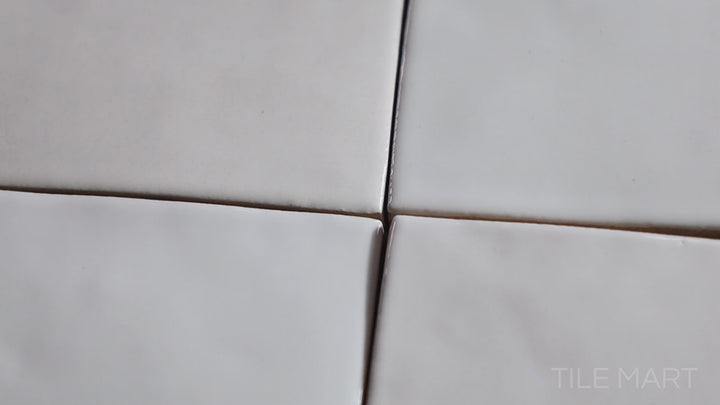 Video of Safi White 2x6 Glossy Ceramic. A crisp white glossy ceramic tile with a reflective surface, perfect for a clean and timeless aesthetic.