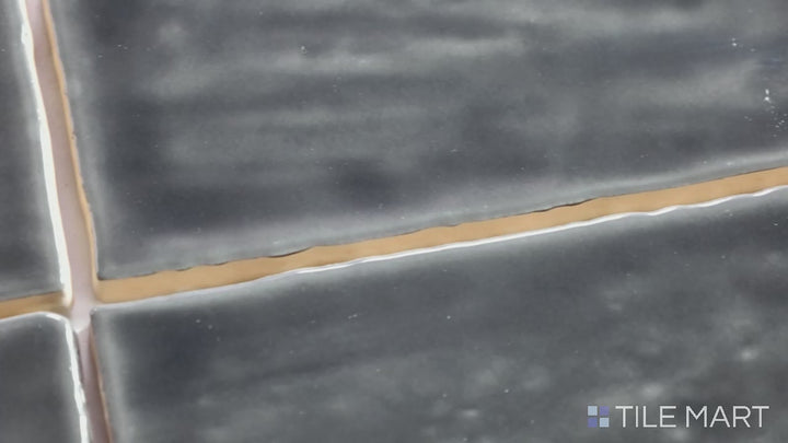 Video of Marin Black Sea 2.5X5 Gloss Glazed Ceramic. A deep black glossy tile with a sleek finish, perfect for a bold and dramatic look.