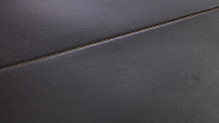 Video showcasing Kite Black 4x12 Matte Porcelain. A deep black matte porcelain tile with a sleek surface, delivering a bold and modern aesthetic.