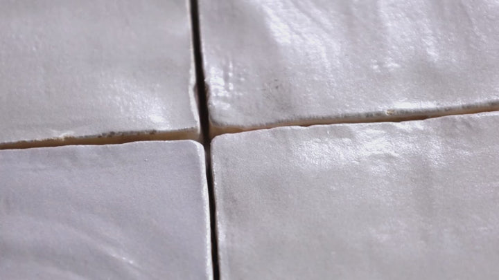 Video highlighting Mallorca Grey 4x4 Matte Ceramic. A subtle grey matte ceramic tile with a refined finish, blending modern style with timeless charm.