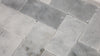 Video of Minute Mosaix Carrara White Herringbone Marble, Limestone Mosaic. A classic Carrara marble mosaic in a stylish herringbone pattern, perfect for elegant spaces.