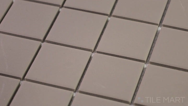 Video of Marin Coastal Cliff 2" Square Matte Glazed Porcelain Mosaic. A neutral-toned square mosaic tile with a smooth matte finish, ideal for coastal and contemporary spaces.