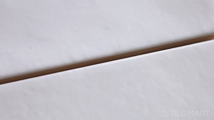 Video of Village White 2.5X8 Glossy Ceramic. A clean, crisp white subway tile with a glossy surface for a classic, bright interior.