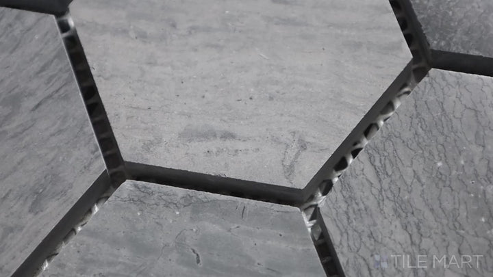 Video showcasing Sto-Re Wooden Blue 2-1/2" Hexagon Polished Marble Mosaic. A stunning Wooden Blue marble mosaic with a polished sheen, arranged in a larger hexagonal format for a contemporary look.