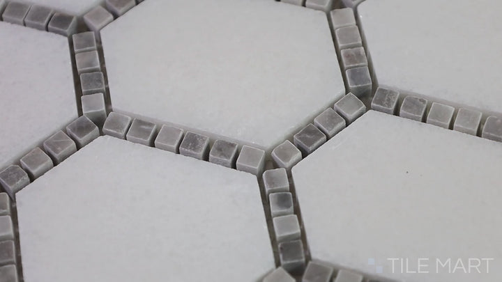 Video featuring The Finish Line Manor Gray Hexagon Polished Marble Mosaic. A modern hexagonal marble mosaic in gray tones, delivering a refined and timeless look.