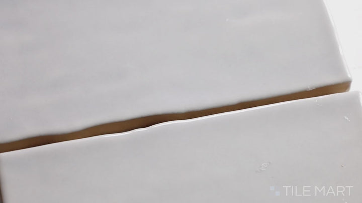 Video featuring Marin Pebble Gray 2.5X5 Gloss Glazed Ceramic. A cool gray glossy tile with a sleek surface, perfect for contemporary designs.