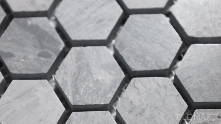 Video of Sto-Re Wooden Blue 1-1/8" Hexagon Polished Marble Mosaic. A unique Wooden Blue marble mosaic with a polished sheen, arranged in a hexagonal format for modern aesthetics.