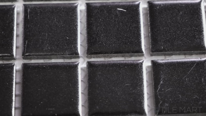 Video highlighting Porcelain Glazed Mosaics Black 1-inch Square Matte. A deep black matte porcelain square mosaic, perfect for bold, contemporary designs.