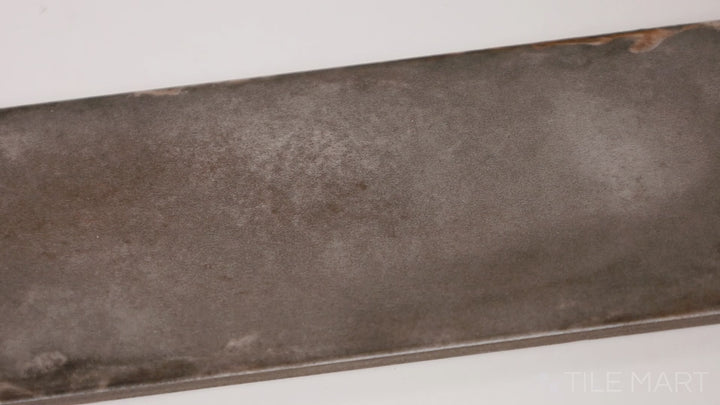 Video highlighting Organic Clay Taupe 2X10 Glossy Ceramic. A rich taupe tile with a glossy surface, adding warmth and elegance to any space.