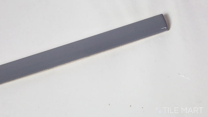 Video of Roxy Hematite 0.5x9 Glossy Porcelain Pencil. A deep hematite-tone glossy porcelain pencil tile, ideal for accenting and finishing touches.