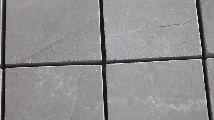 Video of Luxury Amani Grey 2-inch Square Polished Porcelain Mosaic. A grey polished porcelain mosaic with fine veining, delivering a modern and elegant aesthetic.