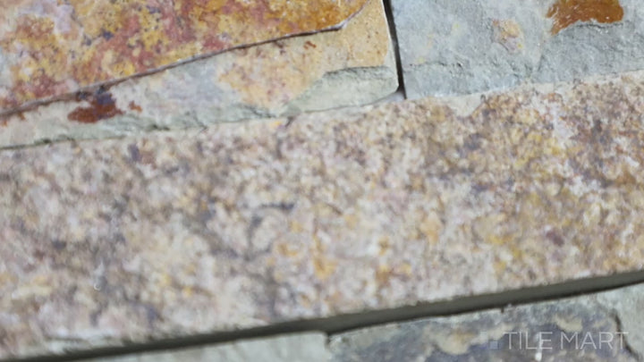 Video of Rockmount Gold Rush 6X24 Stacked Stone Panel Splitface Slate. A stacked stone panel with rich gold and brown tones, adding depth and texture to walls.