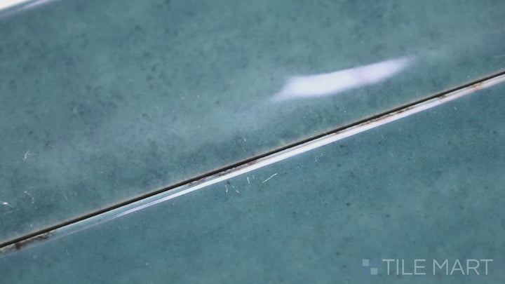 Video of Calpe Blue 2X6 Glossy Porcelain. A vibrant blue glossy porcelain tile that brings a refreshing coastal vibe and high-end elegance to interiors.