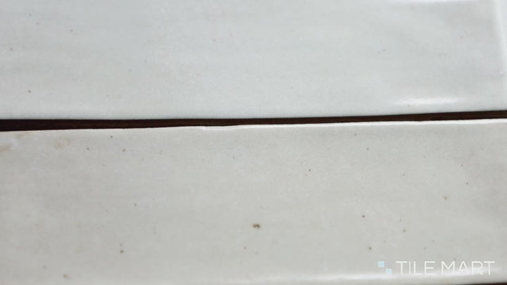 Video featuring Celine White 2.5X12 Gloss Glazed Porcelain. A luminous white glossy tile that enhances light reflection and adds a polished touch to any room.