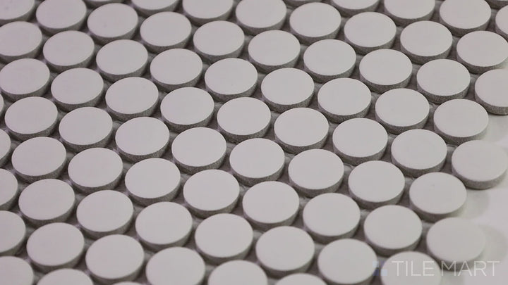 Video of Marin Ocean Teal 3/4" Penny Round Matte Glazed Porcelain Mosaic. A rich teal mosaic, perfect for adding a bold pop of color with a subtle matte finish.