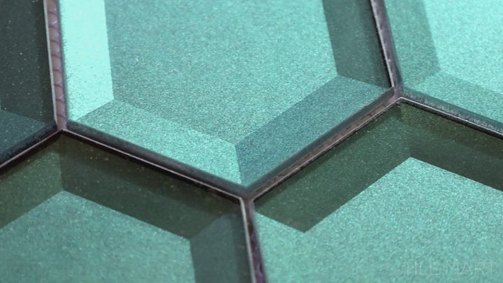Video featuring Bold Glass Green 3-inch Hexagon Glossy Mosaic. A rich green glass tile with a polished glossy sheen, designed to bring a fresh and dynamic look with its geometric hexagon shape.