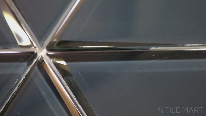 Video highlighting Modern Glass Dark Grey 6-inch Triangle Glossy Mosaic. A deep dark grey glass tile with a reflective glossy sheen, arranged in a sleek triangular format for a sophisticated design.