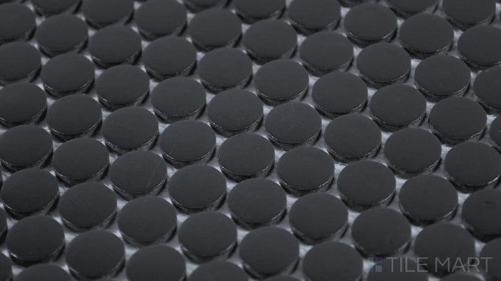 Video of Marin Black Sea 3/4" Penny Round Matte Glazed Porcelain Mosaic. A deep black penny round tile with a soft matte texture, adding a sleek, modern edge.