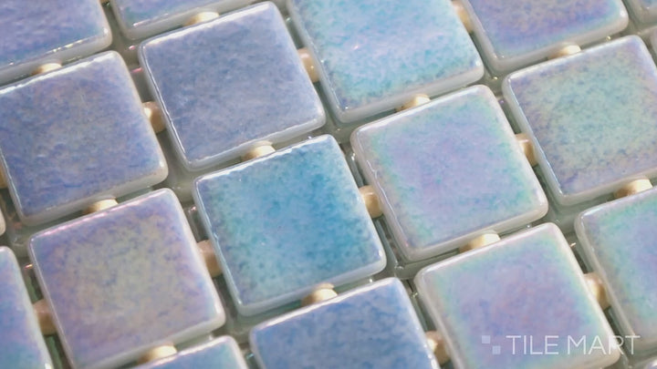 Video highlighting Opalescent Cielo Azul 1-inch Square Glossy Glass Mosaic. A sky-blue opalescent glass mosaic with a radiant glossy surface, adding vibrancy and depth.