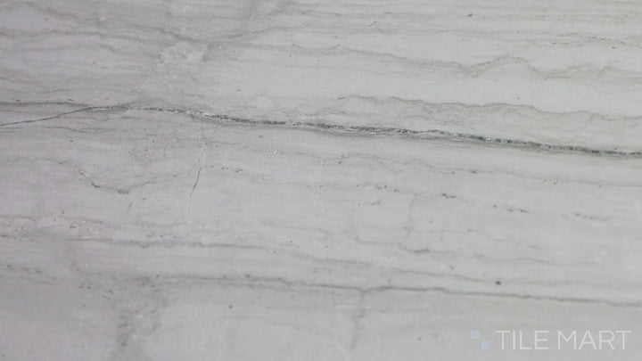 Video showcasing Demira Light Grey 12X24 Polished Porcelain Tile. A soft gray tile with a polished surface, offering a refined and luminous aesthetic.