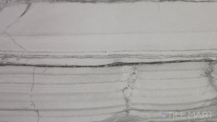 Video featuring Demira Dark Grey 12X24 Polished Porcelain Tile. A deep gray tile with a polished sheen, creating a bold and dramatic statement in any space.