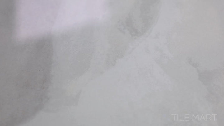 Video highlighting Onyx White 24x48 Polished Porcelain. A pristine white polished porcelain tile with soft veining and a reflective surface, enhancing any space with a refined look.