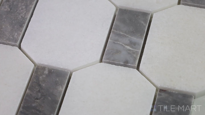 Video featuring The Finish Line Manor Gray Hexagon Polished Marble Mosaic. A luxurious gray marble tile in a geometric hexagonal shape, enhancing any space with elegance.
