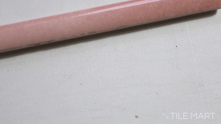 Video of Village Rose Gold 0.5X8 Glossy Ceramic Jolly Trim. A soft pink-toned trim tile with a polished finish, adding a luxurious touch.