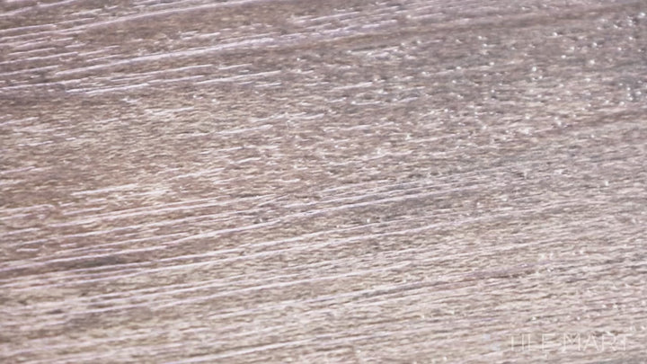 Video highlighting Cyrus Bracken Hill 9X60 Low Gloss Luxury Plank Vinyl. A contemporary gray-brown plank with realistic textures and a smooth matte finish.