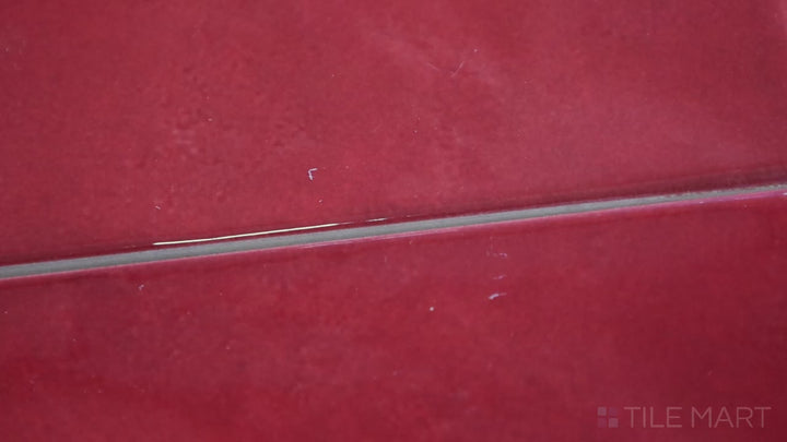 Video highlighting Village Volcanic Red 2.5X8 Glossy Ceramic. A fiery red subway tile with a glossy finish, perfect for bold, energetic spaces.