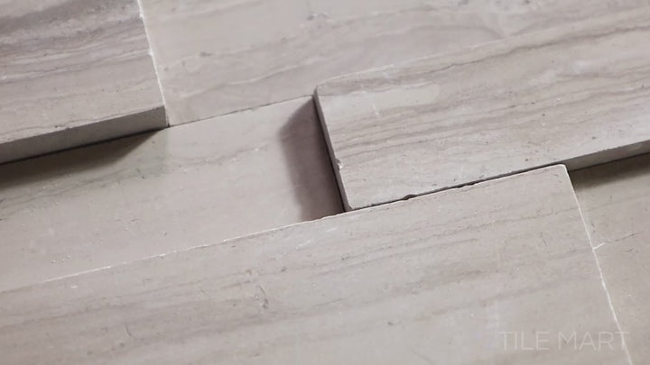 Video showcasing Modern Ledgestone Athens Wood 6x24 Porcelain. A wood-look porcelain tile with a textured surface, combining natural warmth with modern durability.
