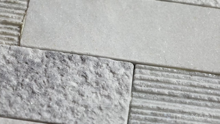 Video featuring Rockmount Gray 6X24 Stacked Stone Panel Splitface Marble. A rugged yet refined splitface marble panel, ideal for natural stone accent walls.