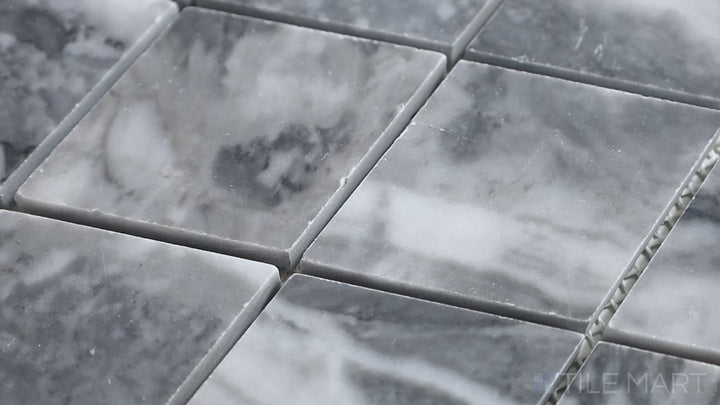 Video showcasing Sto-Re Bardiglio Rhomboid Polished Marble Mosaic. A bold Bardiglio marble mosaic with a polished finish, designed in an elegant rhomboid pattern for a dynamic aesthetic.